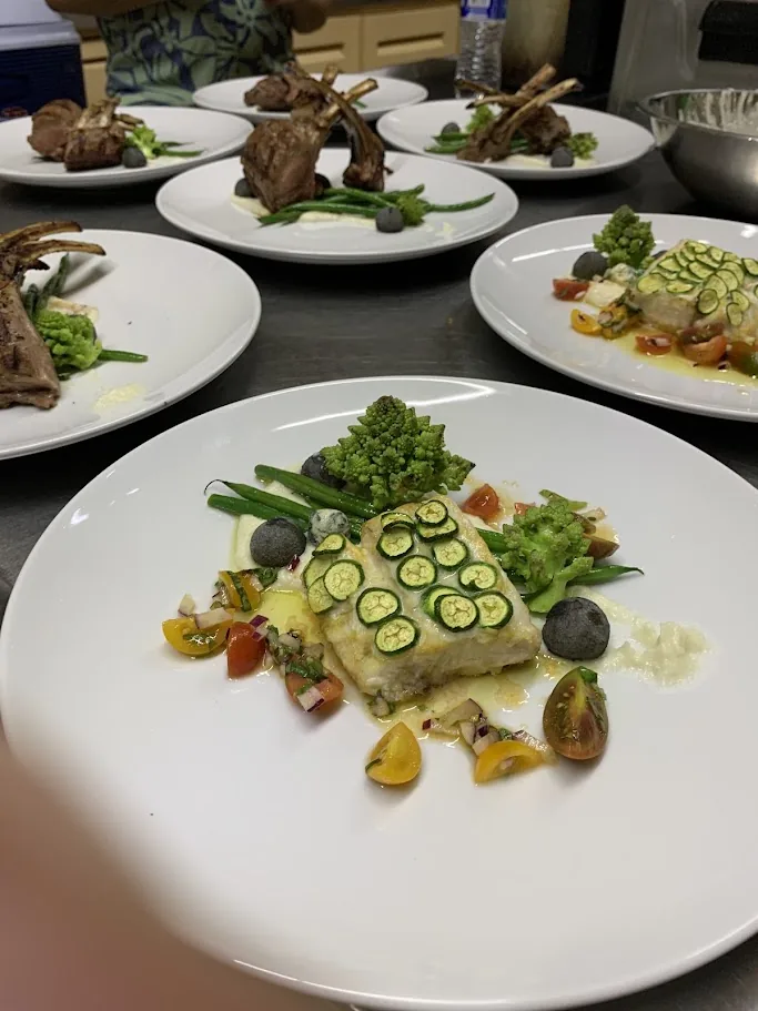 Private dining experience prepared by Chef Franko with plated lamb and fish