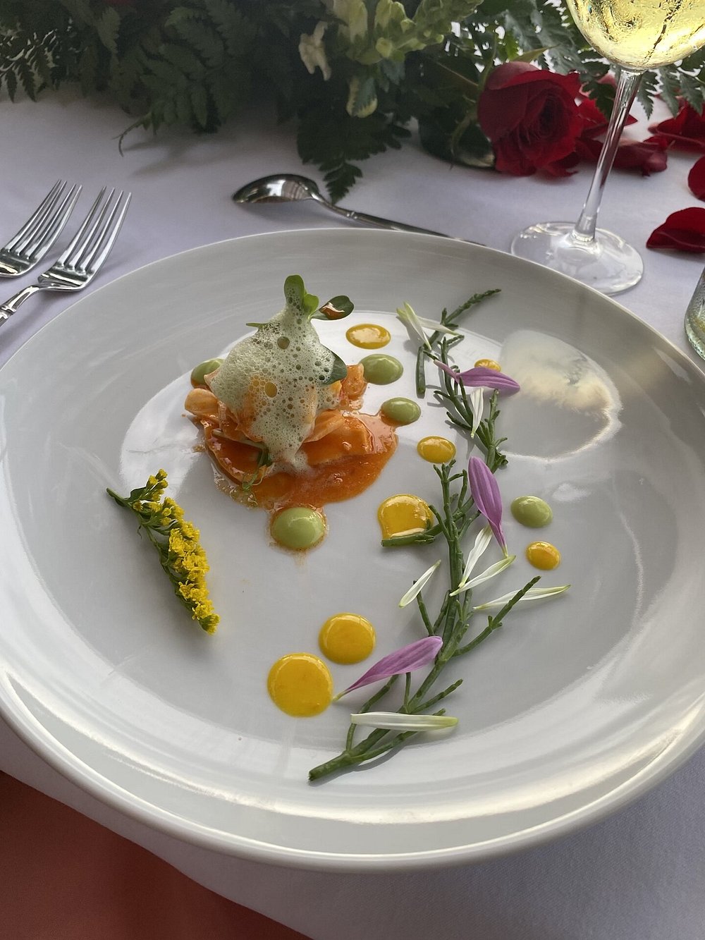 Luxury private banquet dish with edible flowers at a private dinner