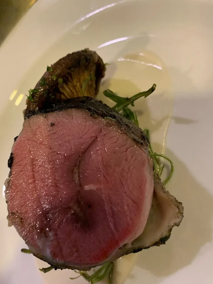Roasted goat shoulder prepared by Chef Franko with seasonal garnish